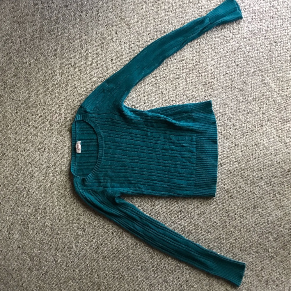 blue open neck sweater